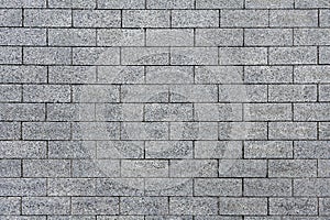 A gray stone brickwork as texture, background