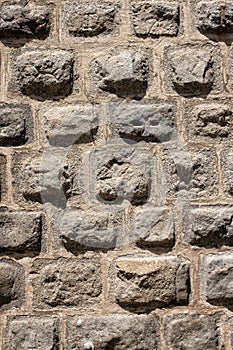 Gray stone wall background in the noon