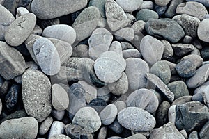 Gray stones close-up. Minimalistic background. Pebble beach.