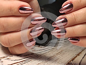 Gray striped nail design on female hand close up