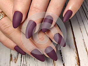 Gray striped nail design on female hand close up