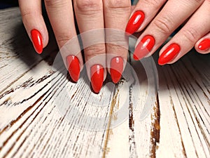 Gray striped nail design on female hand close up