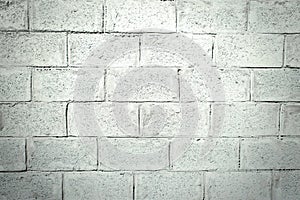 Gray stucco brick wall. Texture of stucco with a pattern of bricks. Gray cement plaster background .