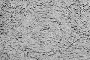 Gray stucco on wall of house.