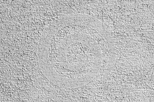 Gray stucco on wall of house.