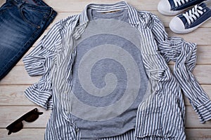 Gray T-shirt mockup with striped shirt and jeans