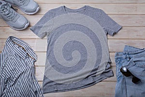 Gray T-shirt mockup with sunglasses and blue jeans