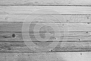 Gray table of narrow boards as background. Texture of old wood