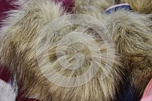 Gray texture of fluffy fur on the collar of clothes