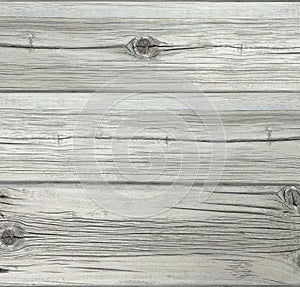 Gray textured aged wood planks with cracks. Old boards from weathered grey plan