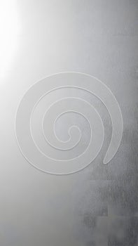 Gray textured surface with light and shadow gradient background