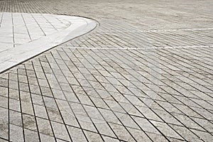 Gray tiled floor background. Old town square.