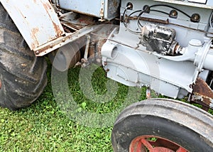 Engine details of a gray tractor