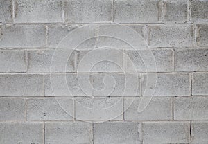 Gray wall made of large concrete blocks