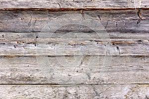 Gray wall, wooden texture of old beams photo