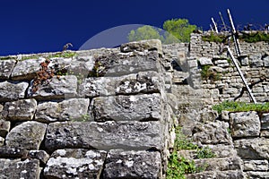 Gray walls against a blue sky