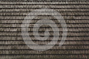 gray weathered wood wall shingles textured background with uniformity horizontal lines from a shingled roof or outdoor weathered