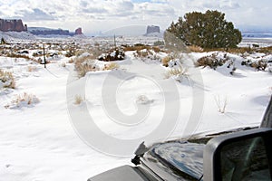 Gray Whiskers, left, and Mitchell, right, Buttes and the desert after a snowfall, Monument Valley photo
