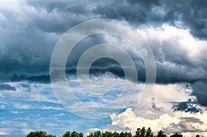 Gray white clouds. Clouds of thunderclouds on a blue sky. Summer day. Beautiful nature background