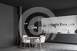 Gray and white kitchen corner with dining table