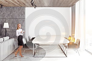 Gray and white loft dining room interior, woman