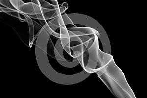 Gray and white smoke on the black background.