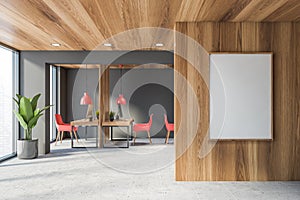 Gray and wood open space office with poster