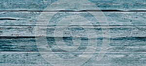 Gray wood texture with traces of cracked aquamarine paint.Abstract background blank template. rustic weathered wood barn