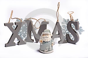 Gray wooden decorative letters X M A S with snowflakes copy space isolated white background, Christmas holidays postcard concept
