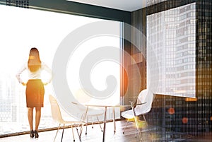 Gray and wooden dining room, woman