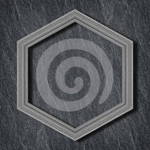 Gray wooden hexagonal frame isolated on  on Dark grey black slate background or texture background