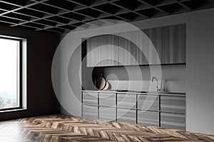 Gray and wooden kitchen corner with cupboards