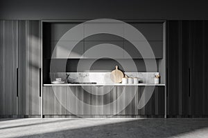 Gray and wooden kitchen with cupboards