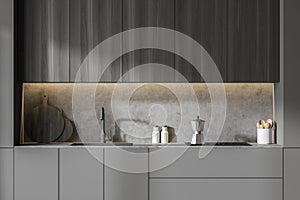 Gray and wooden kitchen with cupboards, close up