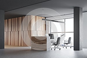 Gray and wooden office cubicles, side view