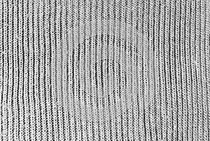 Gray woolen knitwear fabric texture. Closeup of sweater, knitted pattern background. Winter design. Flat lay, top view. photo
