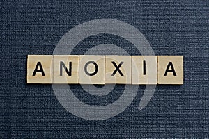 Gray word anoxia from small wooden letters