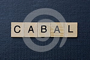 Gray word cabal from small wooden letters photo