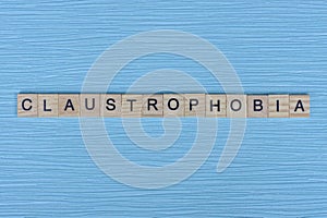 gray word claustrophobia from small wooden letters