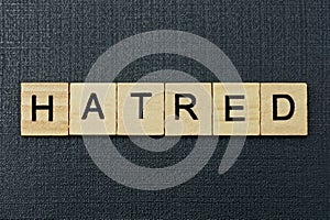 Gray word hatred from small wooden letters