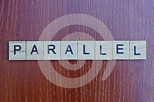 Gray word parallel made of wooden square letters