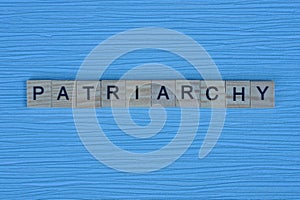 Gray word patriarchy from small wooden letters photo
