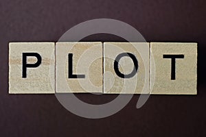 Gray word plot made of wooden square letters