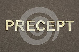 gray word precept made of wooden letters