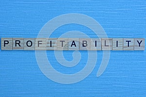 gray word profitability from small wooden letters