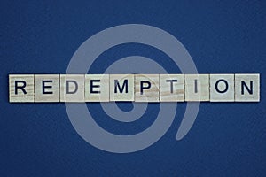 gray word redemption from small wooden letters