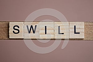 Gray word swill made of wooden square letters