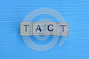 Gray word tact from small wooden letters photo