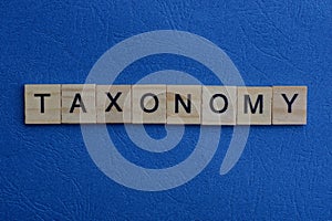 Gray word taxonomy from small wooden letters