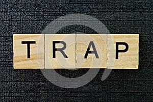 Gray word trap from small wooden letters